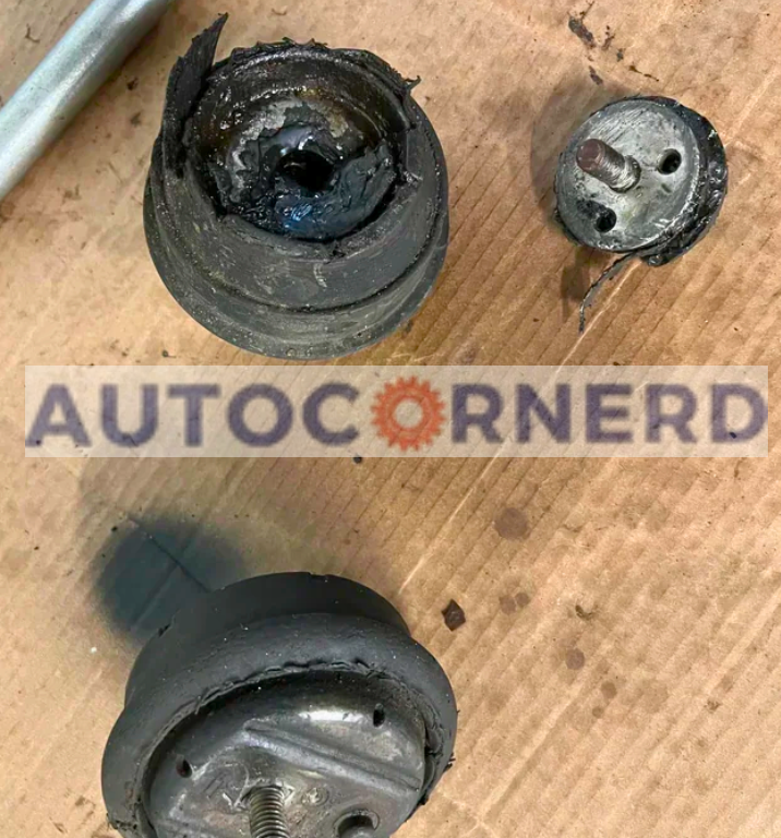 Removed engine mounts showing separated rubber and metal components.
